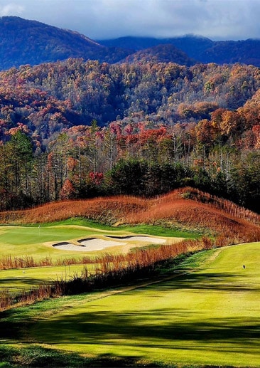 golf course view with mountain forest in fall