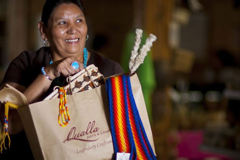 cherokee woman with bag full of crafts