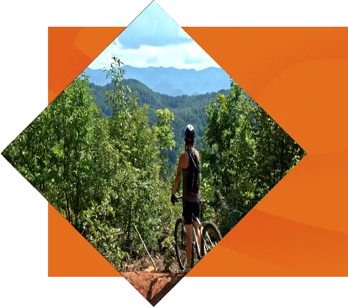 Biker overlooking mountains