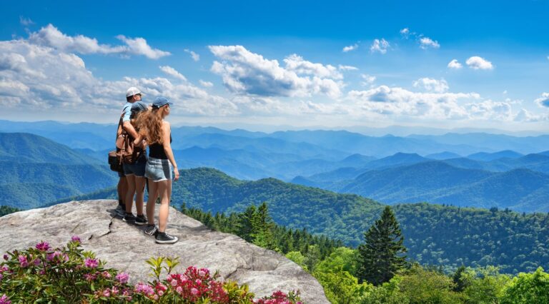 family looking out at the smoky mountains