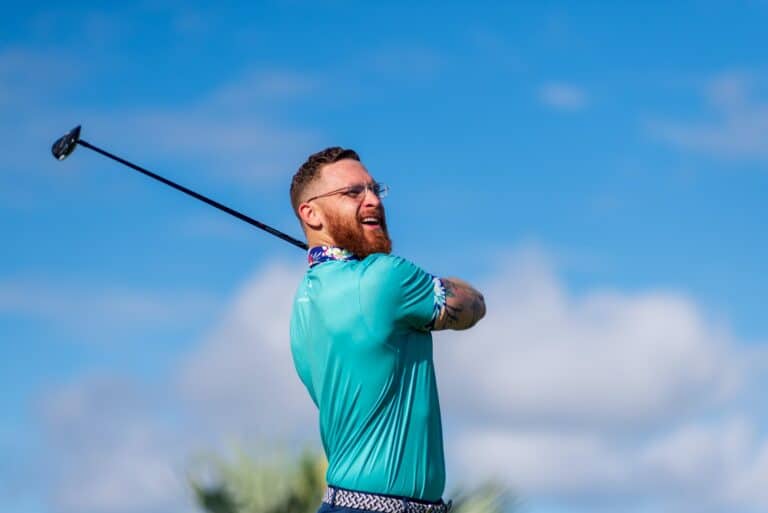 golfer watching his ball after hitting