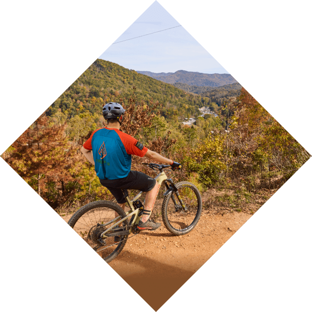 mountain biker overlooks the scenic view of the mountains