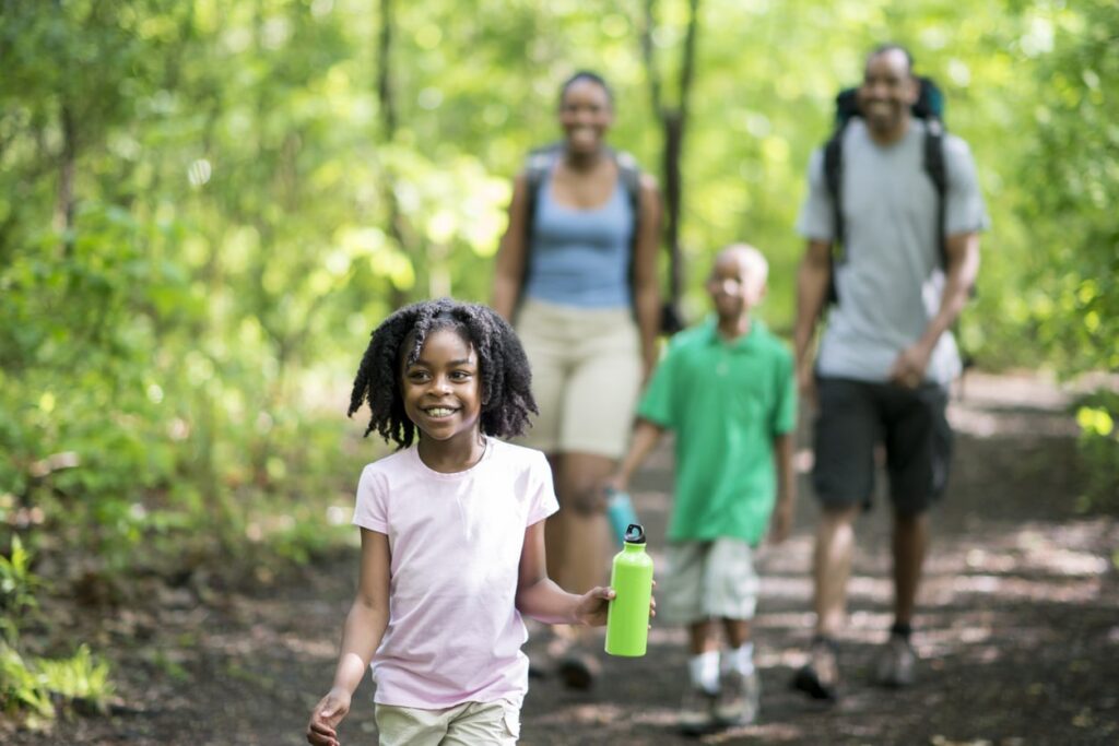 kid holding a water bottle