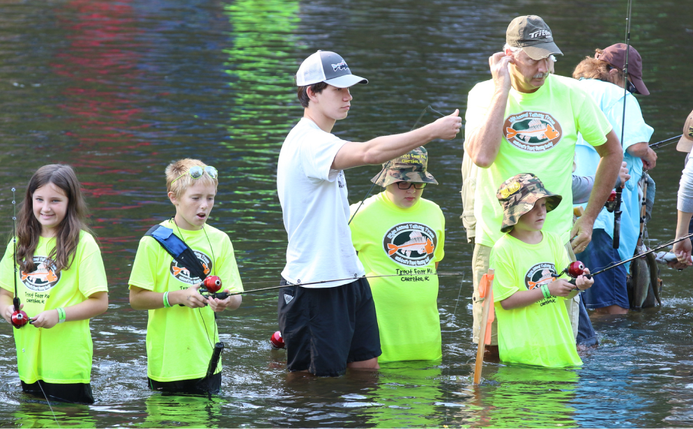 kids in the water at the trout derby