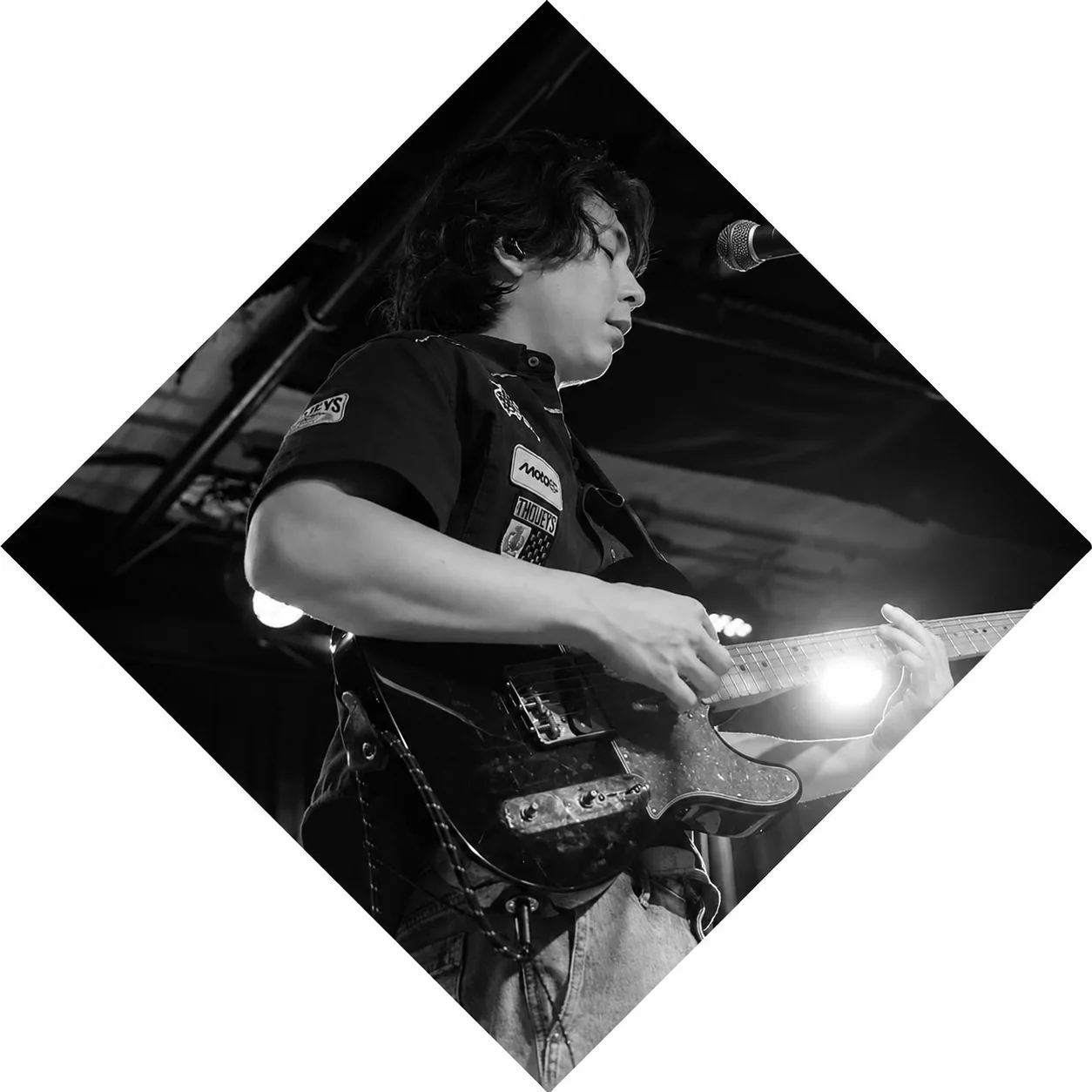 Holden Le Dinh playing guitar.